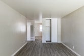 Located at 604 Leslie Dr in Salinas, California, this single-story 1-bedroom, 1-bathroom residence offers a clean, modern aesthetic with thoughtful updates throughout. Light-toned luxury vinyl plank flooring flows through the main living areas, complemented by neutral wall tones that create a bright, cohesive atmosphere.

The living room is a welcoming space, featuring a large window that draws in natural light and a paneled front door that opens directly to the exterior. Adjacent to the living area, the dining room provides a natural transition into the kitchen, which stands out as a well-equipped space with white shaker-style cabinetry, light quartz countertops, a subway tile backsplash, and a full suite of stainless steel appliances including a gas range, dishwasher, and refrigerator.

The bedroom is a comfortable retreat finished with plush carpeting, a window with neighborhood views, and a built-in sliding-door closet. An additional closet provides extra storage convenience. The bathroom is clean and modern, featuring a white vanity with a marble-style countertop, a tiled tub-and-shower combination with a curved curtain rod, and a frosted window for natural light. A hallway connects the rooms efficiently, completing this well-organized and move-in-ready home.