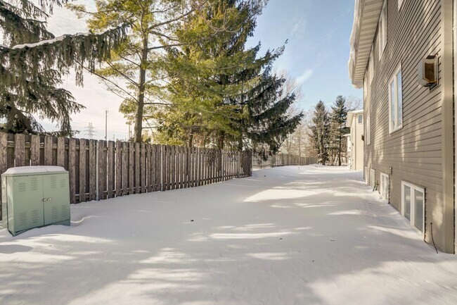 Fence between road and backyard green space - 6107 White Pine Way