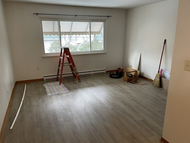 Living room, window with natural light facing quiet (alley) side of building - 17828 Park Ave