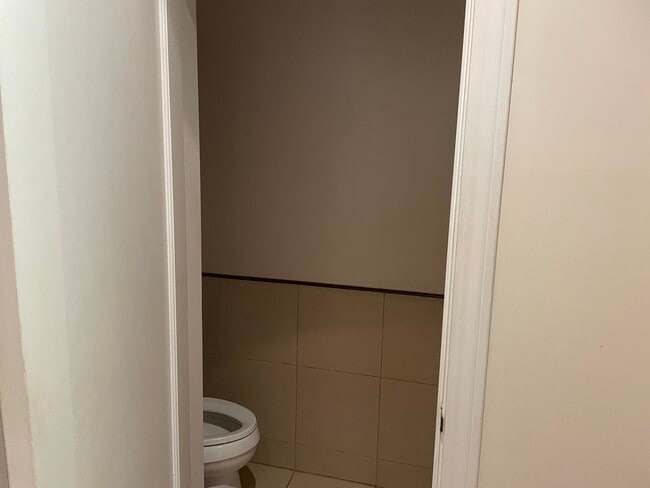 Half bath located to the right of the entry way - 2577 Bryant St