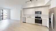 This contemporary 1020 square foot apartment in Boca Raton offers a harmonious blend of style and functionality. The single-story layout encompasses three bedrooms, including a spacious 150 square foot primary bedroom, and two well-appointed bathrooms. The interior showcases a modern aesthetic with clean lines and a neutral color palette, creating a bright and airy atmosphere throughout.

Large windows in the bedrooms and living areas flood the space with natural light, while providing views of the surrounding area. The flooring features light-toned wood-look material, adding warmth and continuity to the space. The bathrooms boast sleek designs with large format tiles, glass shower enclosures, and modern fixtures.

The kitchen is a highlight, featuring crisp white cabinetry, stainless steel appliances, and track lighting, perfect for culinary enthusiasts. The open concept living area seamlessly connects to the kitchen, ideal for entertaining or relaxing. Two closets offer ample storage space, while the hallway ensures easy navigation between rooms.

Located at 201 W Camino Real, this apartment combines urban convenience with Florida's desirable climate, making it an attractive option for those seeking a contemporary living space in Boca Raton.