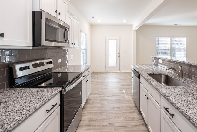 Building Photo - MARCH MADNESS SPECIAL! NEW 3BD Townhome Co...