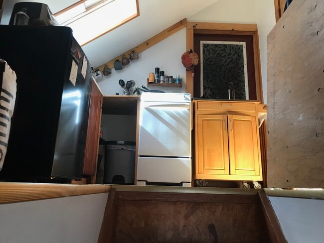 Top of stairs into kitchen & storage area - 657 Maple Hill Rd