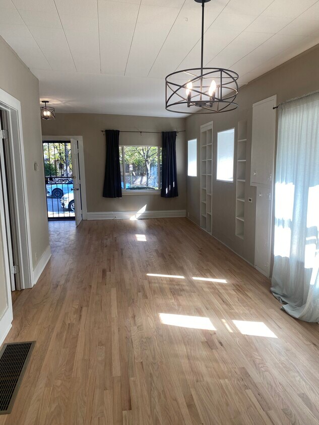 Large open and bright dining and living room. - 395 N Emerson St