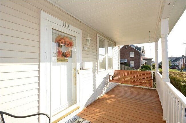 Front Porch with glass storm door and motion light - 110 Patterson Ave