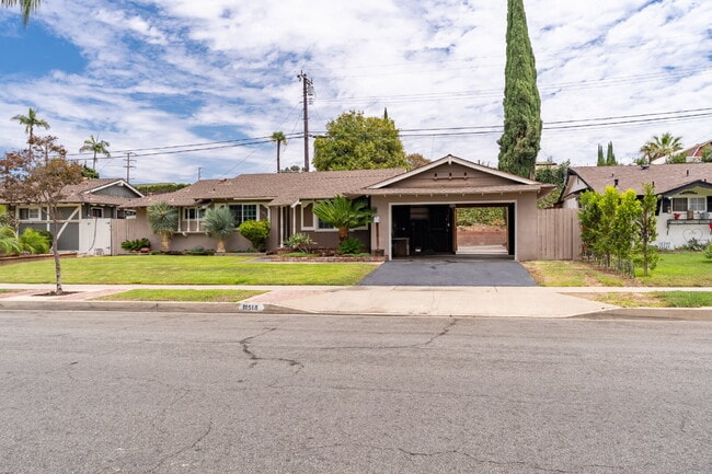 Building Photo - Charming Updated Home With Drive-Through Garage Access