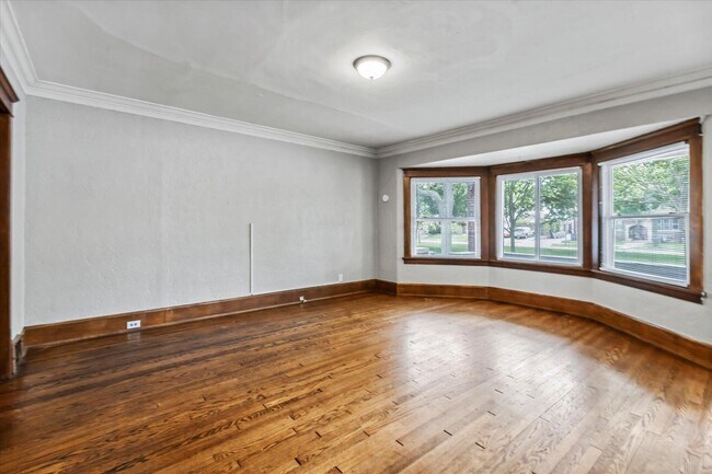 living room with hardwood floors - 1806 E Newberry Blvd