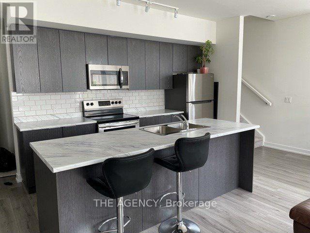 Building Photo - 310 - 3058 SIXTH LINE