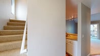 This two-story residence is designed with a clean, neutral palette and a practical layout across both levels. The main living area is open and airy, anchored by a raised-bar kitchen that features white cabinetry, granite-style countertops, stainless steel appliances including a refrigerator and microwave, and track lighting overhead. The kitchen connects visually to the living space, which is carpeted and benefits from generous ceiling height, enhancing the sense of openness. An in-unit stacked washer and dryer is conveniently accessible from the kitchen corridor, adding everyday practicality. A carpeted staircase leads to the upper level, where the bedrooms are located. Each bedroom showcases vaulted ceilings with ceiling fans, sliding-door closets, and light wood-style flooring. One bedroom includes an en-suite bathroom, while an additional full bathroom serves the remaining rooms. Both bathrooms are finished consistently with white cabinetry, granite-style countertops, large mirrors, and wood-look flooring. One bathroom features a shower-tub combination with a window above, while the other includes a walk-in shower. Throughout the space, a cohesive neutral tone and consistent finishes create a calm and functional living environment.