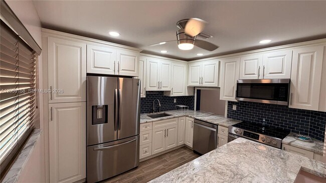 Building Photo - 6090 N Sabal Palm Blvd