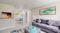 Located in Houston, TX, this single-story 2-bedroom, 2-bathroom home offers a thoughtfully arranged layout designed for comfortable everyday living. Light-toned tile flooring runs throughout, contributing to a clean, cohesive aesthetic across the space.

The living room is bright and welcoming, featuring a large window that allows generous natural light to fill the room and offers views of the outdoors. It flows seamlessly into the dining area, which is lit by a classic chandelier, creating an open and connected main living space.

The galley-style kitchen is efficiently designed with dark cabinetry, granite-look countertops, a stone mosaic tile backsplash, and white appliances. A pantry provides additional storage, keeping the kitchen organized and functional. In-unit laundry adds everyday convenience.

The primary bedroom is generously sized, with a wide window that invites natural light and a textured ceiling. The second bedroom also features a window with outdoor views and offers comfortable space. Both bedrooms have access to closets, with five closets distributed throughout the home. Each of the two full bathrooms is finished in white tile and includes a tub-shower combination. Hallways connect the rooms efficiently, completing this practical and inviting Houston home.