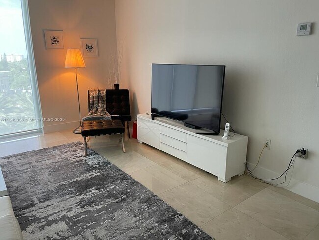 Building Photo - 10275 Collins Ave