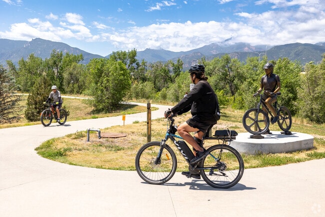 Ride your bike on the Pikes Peak Greenway Trail near Downtown Colorado Springs.
