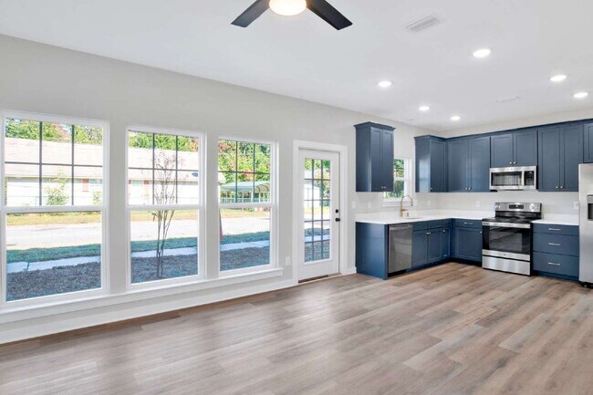 Building Photo - **Available now. This pet-friendly property features a small fenced yard with water and lawn main...