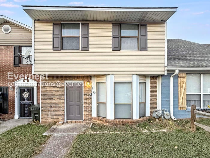 Primary Photo - Spacious Townhome with Fenced Yard and Parking Space