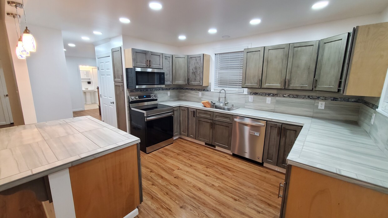 Kitchen from Dining Room lighted - 603 E Atlantic Ave