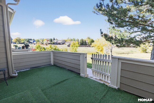 Beautiful front patio deck with a closed fence to enjoy your evenings - 1089 S Walden Way