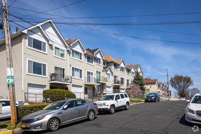 New townhouses with garages and manicured front yards are being developed in Stapleton.