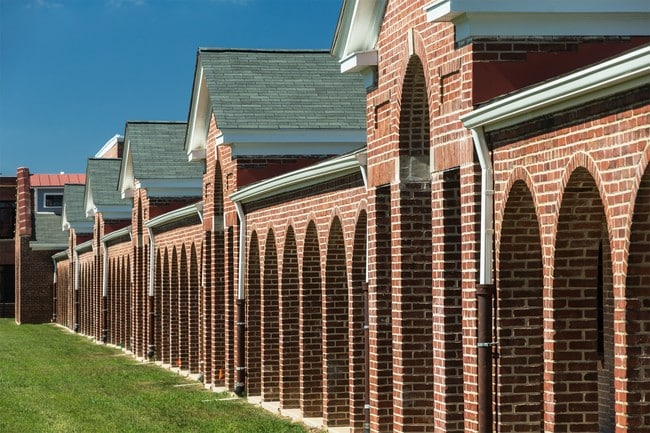 View of the arcades surrounding the historic courtyard at Liberty Crest - Liberty Crest Apartments