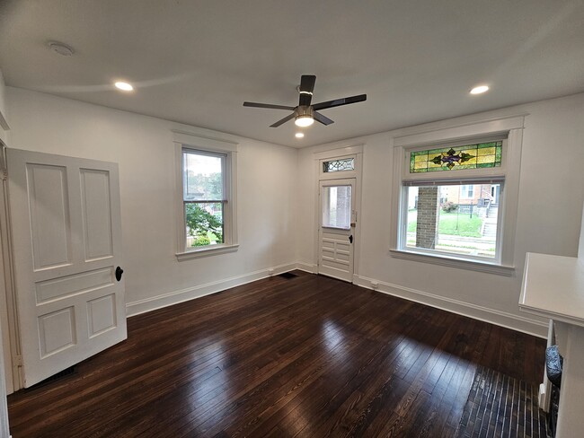 Front room. - 3914 S Madison Ave