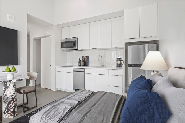 The kitchen and living space of The Script at Midland Lofts - Midland Lofts