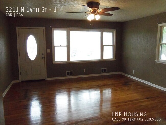 Building Photo - Quiet back yard!  4 bedroom, 2 bath.  Over...