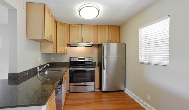 Enjoy upgraded kitchen cabinets and ample counter space - Plantation Gardens