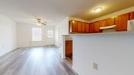 Located at 1900 Cardinal Trail Dr in Galloway, Ohio, this single-story, three-bedroom, two-bathroom home offers a practical and comfortable layout. Light-toned luxury vinyl plank flooring runs consistently throughout, creating a clean and cohesive look across every room. The living area is bright and open, featuring a ceiling fan with light fixture and windows that let in generous natural light, providing a welcoming atmosphere.

The kitchen is well-appointed with warm honey-toned wood cabinetry offering ample storage, light countertops, and a full suite of appliances including an electric range and refrigerator. A peninsula counter connects the kitchen to the living area, enhancing the open feel of the common space.

Three bedrooms provide versatile living options. The primary bedroom is a comfortable size and is accompanied by a closet, while the additional bedrooms each offer natural light through windows with blinds. All rooms feature the same consistent flooring found throughout the home.

Both bathrooms are finished in a clean, neutral palette, each featuring a full soaking tub with shower, a wood-vanity with light countertop, and matching LVP flooring. A dedicated laundry area and hallway round out the floor plan, adding everyday convenience to this efficiently designed home.