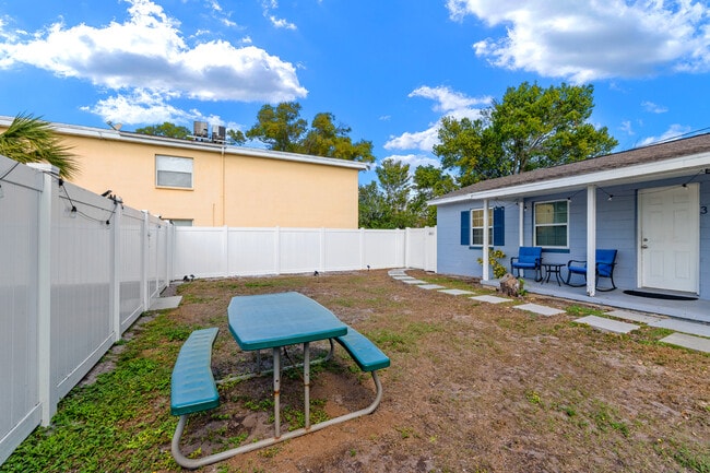 Front porch with porch chairs/table included to enjoy the fenced in backyard - 401 S Mars Ave House