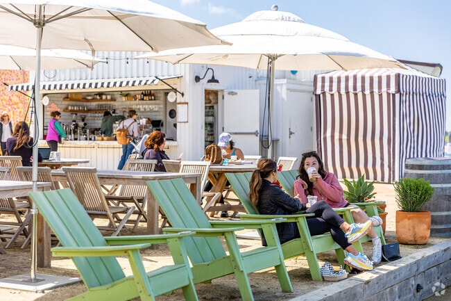 Superbloom Cafe patrons enjoy seating with a view of Mission Bay near Bay Park.