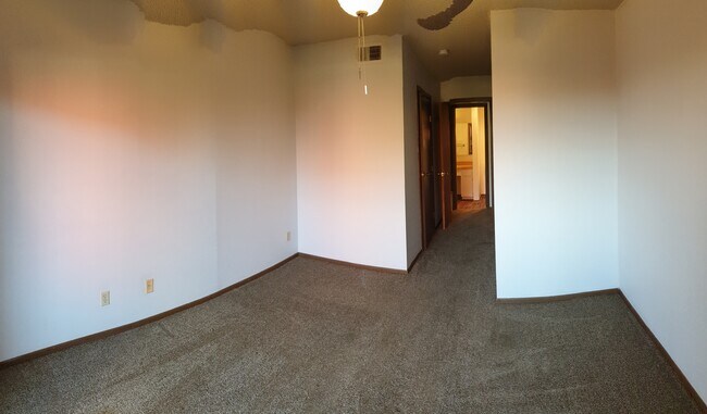 Bedroom with corridor leading to walk-in closet and bathroom - 3243 Nacogdoches