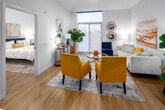 This thoughtfully designed one-bedroom, one-bathroom residence offers a contemporary open-concept layout that maximizes every square foot. Light hardwood flooring flows throughout, complementing the clean white walls and recessed lighting that create a bright, modern ambiance.

The kitchen serves as the centerpiece of the main living area, featuring dark wood-grain flat-front cabinetry, stainless steel appliances, a smooth electric cooktop, and a generous island with a quartz-style white countertop and double undermount sink — ideal for both meal prep and casual dining with bar seating.

The living room benefits from large floor-to-ceiling windows that usher in abundant natural light and offer views of the surrounding neighborhood. The open layout allows the kitchen and living areas to flow seamlessly together, creating an inviting and functional shared space.

The bedroom is a comfortable, well-proportioned retreat with its own large window, light hardwood floors, and direct access to a dedicated closet. The clean lines and neutral palette create a calm atmosphere.

The bathroom is finished with a floating dark wood-grain vanity, a white quartz countertop, an undermount sink, and a large mirror with contemporary vanity lighting — maintaining the modern aesthetic found throughout the residence.