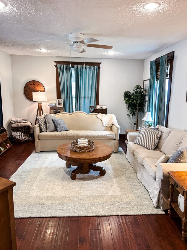 Main living area with laminate flooring - 106 E Madison Ave