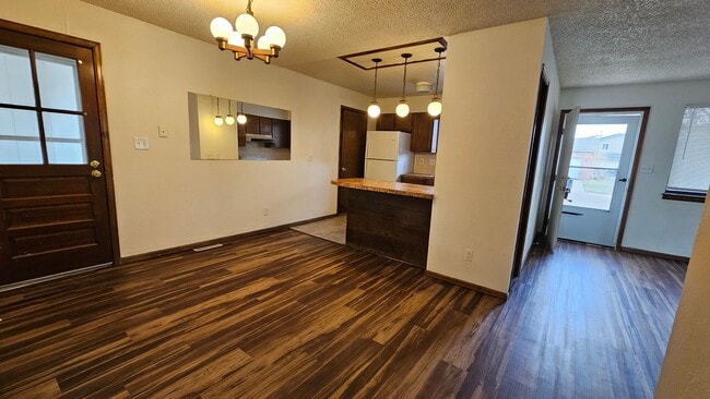 Building Photo - 3 bedroom Ranch Style Duplex backing to open space.