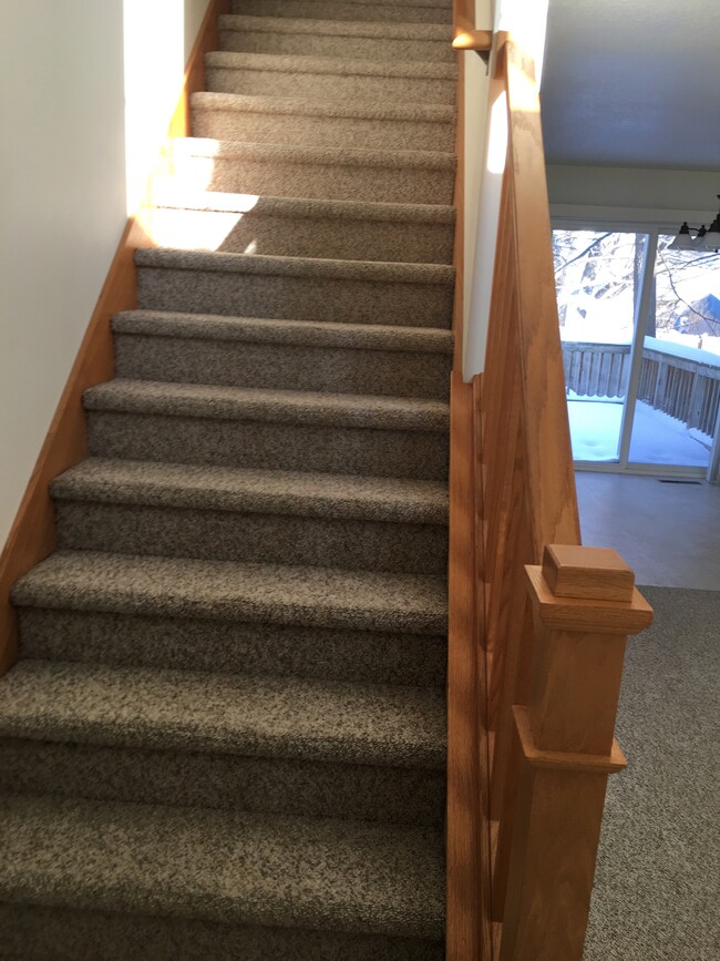 Inside front entry, stairs to second level. - 824 2nd St NW