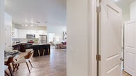 Located at 2021 Bluff Creek St in El Paso, TX, this single-story 2-bedroom, 2-bathroom home offers a thoughtfully designed open-concept layout. The kitchen is a standout feature, equipped with stainless steel appliances, granite countertops, white upper cabinetry, rich dark lower cabinetry, track lighting, and a breakfast bar with seating — ideal for both casual dining and entertaining. The kitchen flows seamlessly into the living room, which is bright and welcoming with wood-style flooring and generous natural light. Both bedrooms are carpeted and well-lit, featuring ceiling fans, large windows with outdoor views, and comfortable proportions. The primary bedroom is a relaxing retreat of notable size. The bathrooms are well-appointed, with the primary bath showcasing a wide vanity, granite countertops, warm wood cabinetry, and a large framed mirror with overhead lighting. Additional spaces include two closets and a dedicated laundry room. Throughout the home, a neutral color palette, clean lines, and consistent finishes create a cohesive and modern aesthetic that balances comfort with functionality.