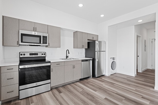 Building Photo - East Line Apartments - Live on Main Street...