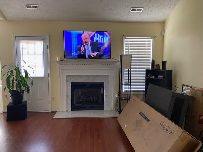 Living room showing fireplace and door to backyard - 1487 Oldstead Dr