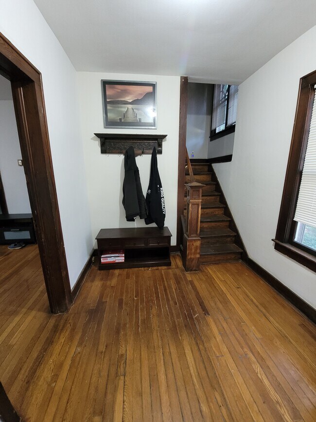 Entryway has lots of character and place to hang jackets and coats - 164 Helen St