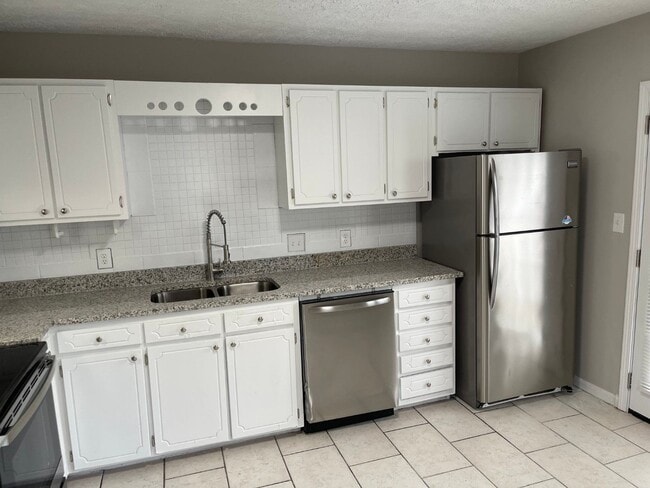 Building Photo - Corner unit, parking for 2 cars, LVP floor...