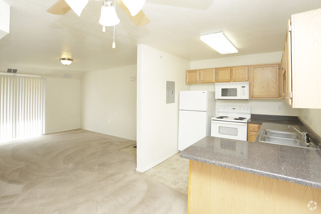 Kitchen with Carpet - Bridger Pointe