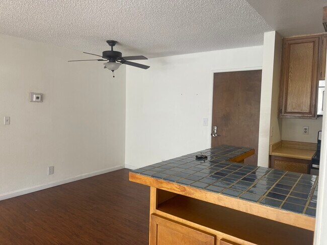 Dining area and bar area/kitchen entrance - 4589 Via Marisol