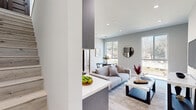 Located in Los Angeles, CA, this contemporary two-story home offers a well-designed layout spread across two floors, combining modern aesthetics with functional living. The main level features an open-concept kitchen and living room filled with abundant natural light from large windows that frame views of the surrounding landscape. The living area showcases light hardwood flooring, recessed lighting, and a clean, neutral palette that creates a bright and welcoming ambiance. A dedicated dining space completes the main living area.

The upper level hosts two bedrooms, each offering private balcony access through floor-to-ceiling sliding glass doors, allowing for outdoor views and ample sunlight. The primary bedroom is a well-proportioned retreat featuring a closet, recessed lighting, and serene mountain views from its balcony. The second bedroom mirrors a similarly light and airy feel. Both bathrooms are finished in a crisp, modern style with tiled shower-tub combinations, brushed nickel fixtures, and light wood flooring. Additional highlights include in-unit laundry, multiple closets, a hallway connecting the upper-level rooms, and two staircases facilitating convenient access between floors. The overall design emphasizes clean lines, contemporary finishes, and a cohesive, minimalist aesthetic throughout.