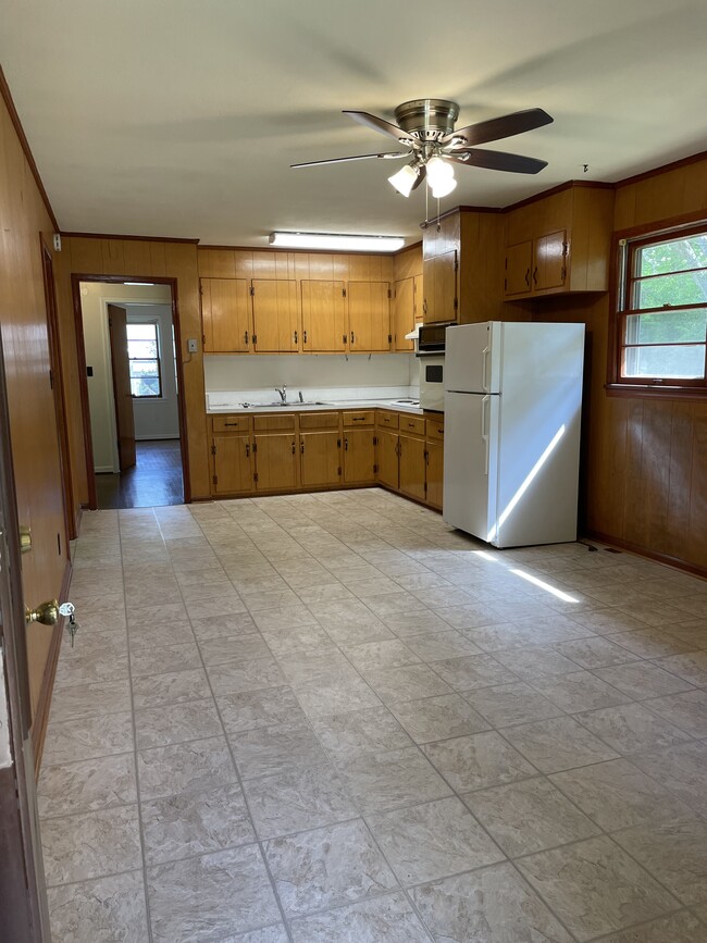 From carport door: dining/kitchen looking into hall and bedroom - 2803 Winters Dr
