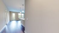 This contemporary single-story residence at 751 Vandenberg Road offers 1050 square feet of thoughtfully designed living space. The home features three bedrooms, including a generous 190 square foot primary suite, and two full bathrooms. The heart of the home is an open-concept kitchen, showcasing rich wood cabinetry, stainless steel appliances, and a convenient island with a breakfast bar. The kitchen flows seamlessly into the living area, which boasts hardwood flooring and ample natural light from large windows. Bedrooms are carpeted for comfort and include ceiling fans for improved air circulation. Bathrooms are finished with modern fixtures, including glass-enclosed showers and spacious vanities. The property also includes two closets for additional storage. Throughout the home, neutral tones and clean lines create a fresh, inviting atmosphere. The layout maximizes space efficiency, making this an ideal choice for those seeking a modern, low-maintenance lifestyle in a compact yet comfortable setting.