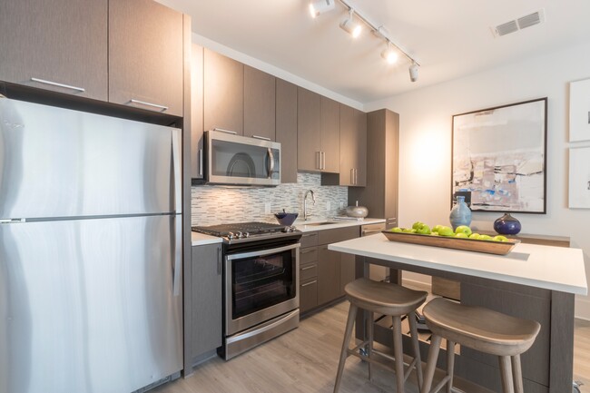 Modern lighting and stainless steel appliances - Modera Midtown