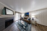Located in Vancouver, WA, this single-floor, 3-bedroom, 2-bathroom home offers a thoughtfully arranged layout with a variety of functional and inviting spaces. The living room serves as the heart of the home, featuring rich wood-style flooring, crown molding, a ceiling fan, and a tile-surround fireplace that adds warmth and character. Natural light filters in through large windows dressed with curtain panels, creating a bright and welcoming atmosphere. Adjacent to the living area, a dedicated dining space benefits from additional windows with views of surrounding greenery.

The kitchen is efficiently laid out and connects seamlessly to the dining and living areas. A cozy breakfast nook with large windows provides a light-filled spot for casual meals. The bedrooms are carpeted for comfort, each offering closet storage. The spacious primary bedroom includes a generously sized closet, while the secondary bedrooms are versatile and well-proportioned. Both bathrooms are finished with wood-look tile flooring, dark wood vanities with granite-style countertops, and tub-shower combinations. A dedicated laundry room houses a full-size washer and dryer, adding everyday convenience. A hallway connects all rooms efficiently, completing this well-organized and functional home.