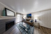 Located in Vancouver, WA, this single-floor, 3-bedroom, 2-bathroom home offers a thoughtfully arranged layout with a variety of functional and inviting spaces. The living room serves as the heart of the home, featuring rich wood-style flooring, crown molding, a ceiling fan, and a tile-surround fireplace that adds warmth and character. Natural light filters in through large windows dressed with curtain panels, creating a bright and welcoming atmosphere. Adjacent to the living area, a dedicated dining space benefits from additional windows with views of surrounding greenery.

The kitchen is efficiently laid out and connects seamlessly to the dining and living areas. A cozy breakfast nook with large windows provides a light-filled spot for casual meals. The bedrooms are carpeted for comfort, each offering closet storage. The spacious primary bedroom includes a generously sized closet, while the secondary bedrooms are versatile and well-proportioned. Both bathrooms are finished with wood-look tile flooring, dark wood vanities with granite-style countertops, and tub-shower combinations. A dedicated laundry room houses a full-size washer and dryer, adding everyday convenience. A hallway connects all rooms efficiently, completing this well-organized and functional home.