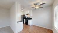Located at 4929 Del Monte Avenue in San Diego's desirable Point Loma neighborhood, this single-floor, one-bedroom, one-bathroom unit offers a practical and comfortable layout. The open-concept kitchen and living area forms the heart of the home, featuring warm hardwood-style flooring, a ceiling fan with light fixture, and a window that allows natural light to fill the space. The kitchen is well-equipped with white cabinetry, dark countertops, black appliances including a refrigerator and electric range with overhead ventilation, and a dishwasher — providing ample storage and functionality. The bedroom is a comfortable size, finished with plush carpeting, a wide mirrored sliding-door closet, and a window overlooking the surroundings, adding brightness to the room. A textured ceiling is present throughout the space. The full bathroom includes a combined tub and shower, a dark-countered vanity with white cabinetry, hardwood-style flooring, and a small window for ventilation. Clean white walls and neutral tones throughout create a cohesive and move-in-ready aesthetic, making this unit a practical choice in a sought-after San Diego location.