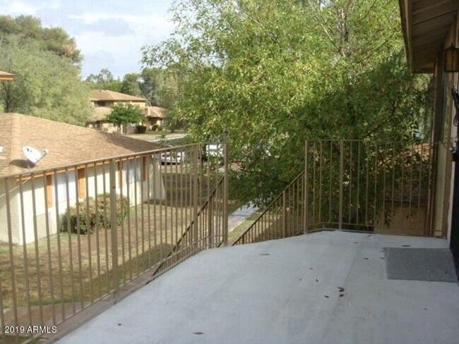 Photo - 2 BEDROOM 1 BATH UPSTIARS UNIT WITH BALCON... Townhome